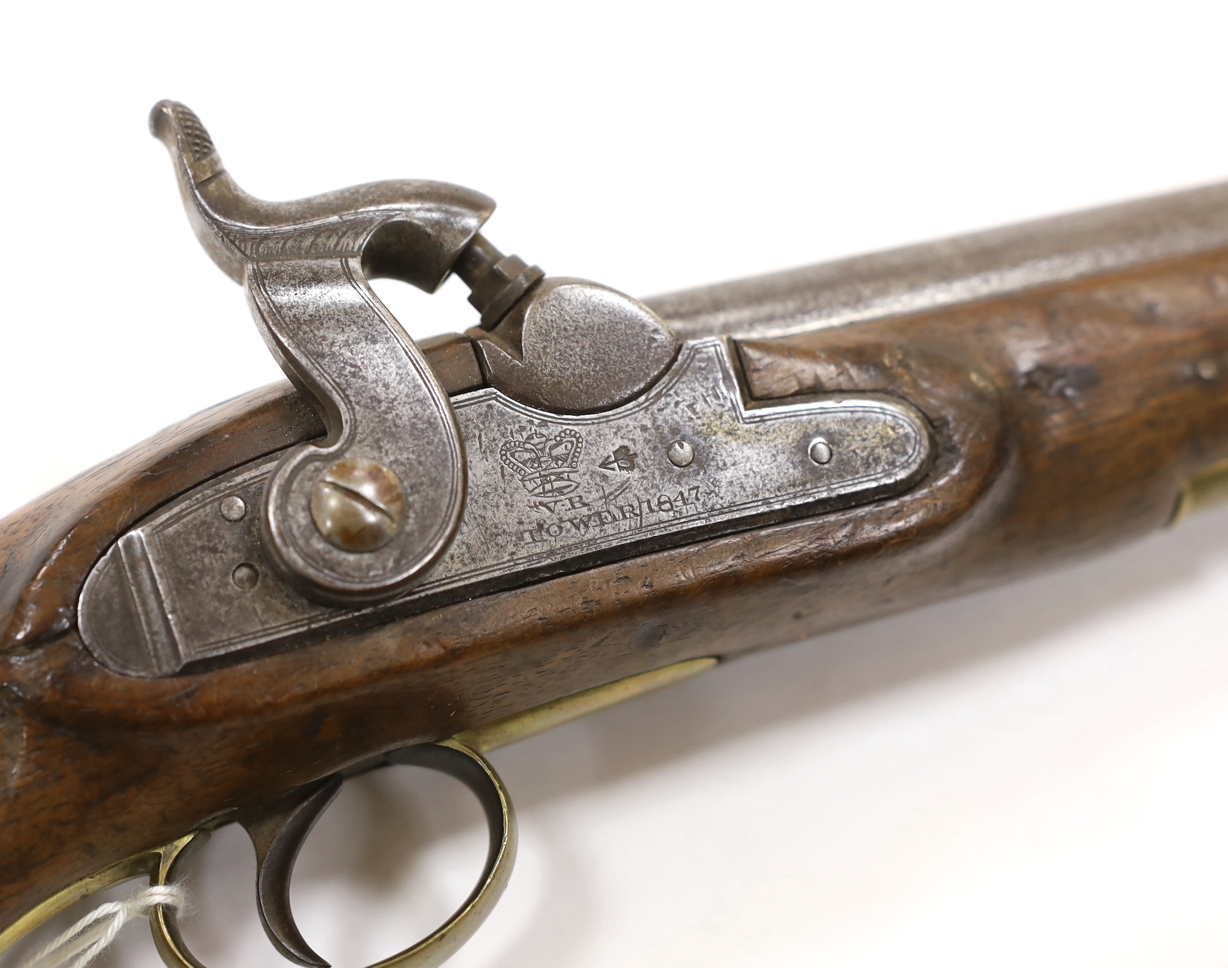A .65” Sea Service percussion belt pistol, proofed barrel, regulation lock engraved with crowned VR, Tower 1847, regulation brass mounts, sprung iron belt hook, swivel lanyard ring and swivel ramrod